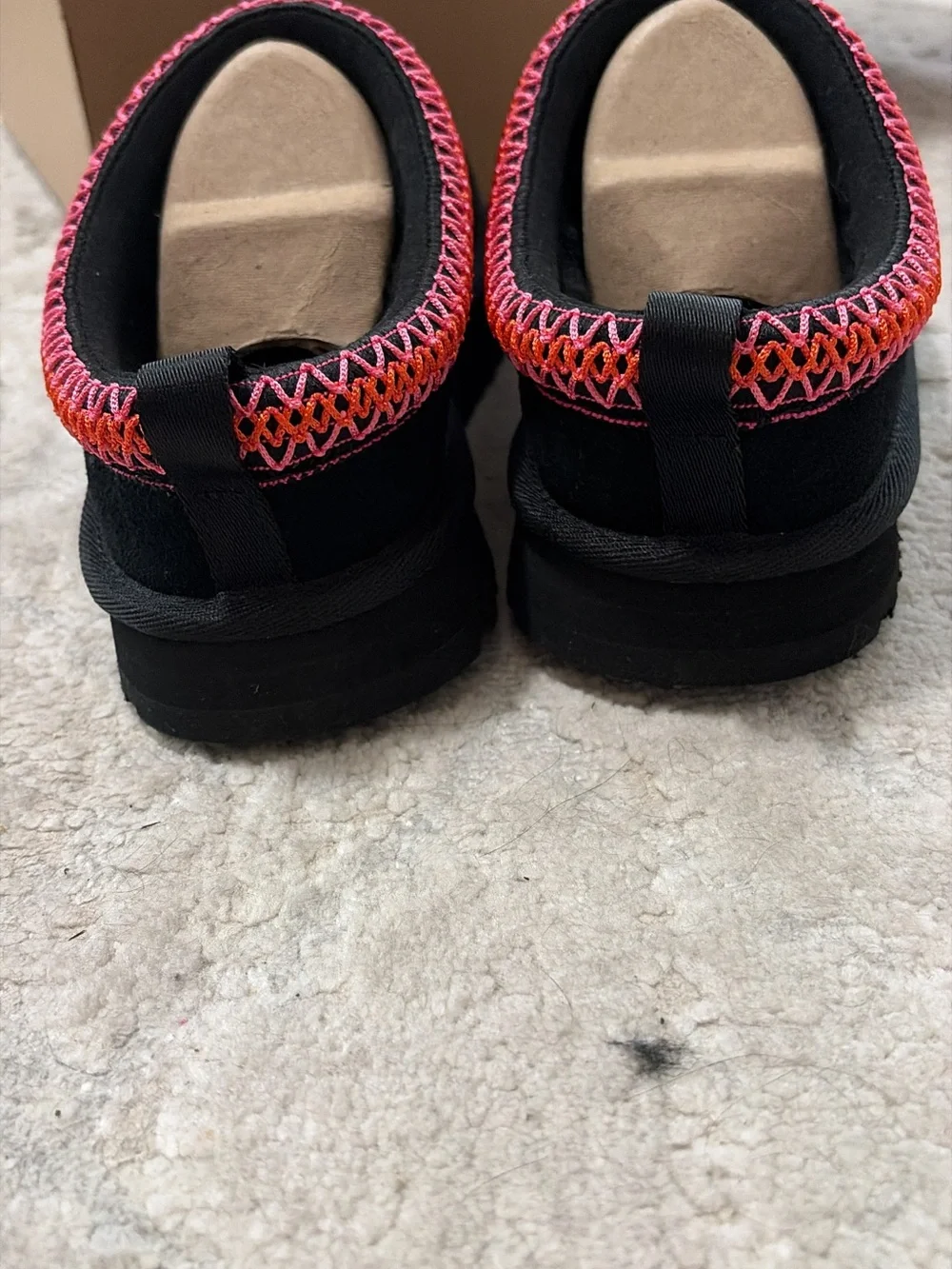 UGG kids Black Slip-On with Pink and Orange Braided Trim